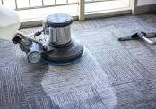 A floor cleaning machine is on the ground.